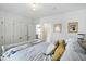 This is a bedroom with a sleigh bed, neutral colors and multiple closets at 5312 Norwaldo Ave, Indianapolis, IN 46220