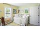 Bright Bedroom featuring a daybed, area rug, and multiple windows providing natural light at 5312 Norwaldo Ave, Indianapolis, IN 46220