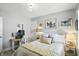 Serene bedroom featuring a bed with decorative pillows, a desk and multiple artworks on the walls at 5312 Norwaldo Ave, Indianapolis, IN 46220