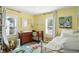 Bright Bedroom featuring a crib, changing table, area rug, and white trim throughout at 5312 Norwaldo Ave, Indianapolis, IN 46220
