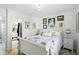 Bedroom with a sleigh bed, neutral walls and an attached bathroom at 5312 Norwaldo Ave, Indianapolis, IN 46220