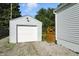 This home features a detached one-car garage with oversized gravel driveway at 5312 Norwaldo Ave, Indianapolis, IN 46220