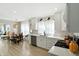 Eat in kitchen with modern appliances, bright white cabinetry and a wooden dining set at 5312 Norwaldo Ave, Indianapolis, IN 46220