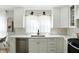 Bright kitchen with white cabinets, stainless steel appliances, and plenty of counter space at 5312 Norwaldo Ave, Indianapolis, IN 46220
