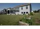 Expansive backyard boasts a covered patio, lush greenery, and space for gardening at 5351 Rose Dr, Zionsville, IN 46077
