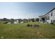 A picturesque backyard featuring a pond with fountain views and a well-manicured lawn at 5351 Rose Dr, Zionsville, IN 46077