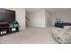 Versatile basement area with TV entertainment, seating, and ample space for recreation and relaxation at 5351 Rose Dr, Zionsville, IN 46077