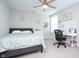 Cozy bedroom with a bed, desk area with a ceiling fan providing a relaxing space at 5351 Rose Dr, Zionsville, IN 46077
