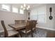 Dining room with hardwood flooring and natural light from the adjacent windows at 5351 Rose Dr, Zionsville, IN 46077