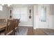 Dining room with light-colored walls, wood floors, and window with natural light at 5351 Rose Dr, Zionsville, IN 46077