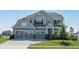 Beautiful two-story home with a well-manicured lawn and two-car garage at 5351 Rose Dr, Zionsville, IN 46077