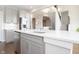 Modern kitchen features gray cabinets, stainless appliances, a large island, and hardwood flooring at 5351 Rose Dr, Zionsville, IN 46077
