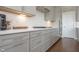 Spacious kitchen features gray cabinets, white countertops, stainless appliances, and subway tile backsplash at 5351 Rose Dr, Zionsville, IN 46077