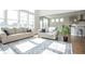 Sun-drenched living area showcasing two sofas and an open floor plan at 5351 Rose Dr, Zionsville, IN 46077