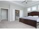 Bedroom features a tray ceiling, carpet, and ensuite bathroom with dual vanities at 5351 Rose Dr, Zionsville, IN 46077