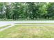 Neighborhood view of the park and street with a side walk and a street sign at 5803 Schoolwood Dr, Speedway, IN 46224