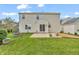 Backyard view featuring a well-maintained lawn, patio area, and lush landscaping for outdoor enjoyment at 6045 Copeland Mills Ct, Indianapolis, IN 46221