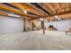 Spacious basement area featuring an open floor plan, perfect for storage or a future living space at 6045 Copeland Mills Ct, Indianapolis, IN 46221