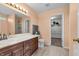 Spacious bathroom with double vanity, walk-in closet, and a separate walk-in shower at 6045 Copeland Mills Ct, Indianapolis, IN 46221