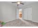 The carpeted bedroom has neutral walls and an adjacent closet and door at 6045 Copeland Mills Ct, Indianapolis, IN 46221