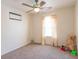 Bright bedroom with a ceiling fan and a cozy window seat at 6045 Copeland Mills Ct, Indianapolis, IN 46221