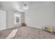 This bedroom is carpeted and features a window with natural light at 6045 Copeland Mills Ct, Indianapolis, IN 46221