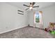This bedroom features neutral walls, a ceiling fan, carpet and a window at 6045 Copeland Mills Ct, Indianapolis, IN 46221