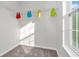 Bright closet space with colorful clothing items and lots of natural light at 6045 Copeland Mills Ct, Indianapolis, IN 46221