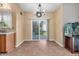 Dining area with sliding glass doors, tile flooring, modern chandelier, and an aquarium at 6045 Copeland Mills Ct, Indianapolis, IN 46221