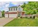 Charming two-story home with a brick facade, well-manicured lawn, and a welcoming front porch at 6045 Copeland Mills Ct, Indianapolis, IN 46221