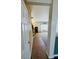 View of the hallway with tiled floors and a partial view of the living room at 6045 Copeland Mills Ct, Indianapolis, IN 46221