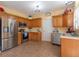 Well-lit kitchen with stainless steel appliances, ample cabinetry, and neutral countertops at 6045 Copeland Mills Ct, Indianapolis, IN 46221