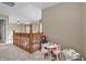 Cozy carpeted upstairs landing with a play table and an overlook railing at 6045 Copeland Mills Ct, Indianapolis, IN 46221