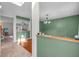 Bright and airy living room with green accent walls, and open access to other rooms at 6045 Copeland Mills Ct, Indianapolis, IN 46221