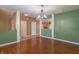Open-concept living room with hardwood floors and views of the kitchen and hallway at 6045 Copeland Mills Ct, Indianapolis, IN 46221
