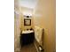 Half bathroom shows a small vanity with a framed mirror at 6045 Copeland Mills Ct, Indianapolis, IN 46221