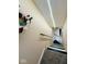 Carpeted stairwell with decorative floral wreath and LED lighting at 6045 Copeland Mills Ct, Indianapolis, IN 46221