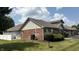 Brick-exterior home with a manicured lawn, offering a cozy outdoor living space at 6139 Robinwood Dr, Indianapolis, IN 46237