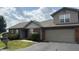 Charming brick home with an attached two-car garage and well-maintained landscaping at 6139 Robinwood Dr, Indianapolis, IN 46237