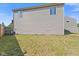 This spacious backyard shows an exterior home elevation and lawn at 618 Stobus Dr, Greenwood, IN 46143
