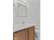 Bathroom featuring a light wood vanity topped with a white sink and a framed mirror at 618 Stobus Dr, Greenwood, IN 46143