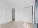 Bright bedroom with carpet, doors and natural light at 618 Stobus Dr, Greenwood, IN 46143