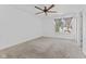 Bedroom with large window, ceiling fan and carpet at 618 Stobus Dr, Greenwood, IN 46143