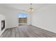 Bright dining area with sliding glass doors and contemporary chandelier lighting at 618 Stobus Dr, Greenwood, IN 46143