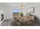 Dining area shows a table with six chairs with a door to the backyard at 618 Stobus Dr, Greenwood, IN 46143