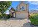 Exterior angle shot featuring well-manicured front lawn and two car garage at 618 Stobus Dr, Greenwood, IN 46143
