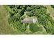 Aerial view of a home hidden among many trees at 6637 E County Road 600 S, Plainfield, IN 46168