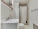 An older bathroom with a vanity, toilet, shower-tub and overhead storage at 6637 E County Road 600 S, Plainfield, IN 46168