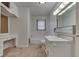 An older bathroom with a vanity, toilet, shower-tub, medicine cabinet and sconce lighting at 6637 E County Road 600 S, Plainfield, IN 46168