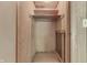 The bedroom closet features open shelving, hanging rod and lots of potential at 6637 E County Road 600 S, Plainfield, IN 46168